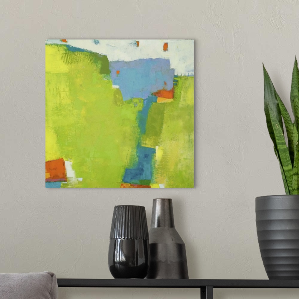 A modern room featuring Abstract contemporary art in tropical lime green, blue, and bright orange.