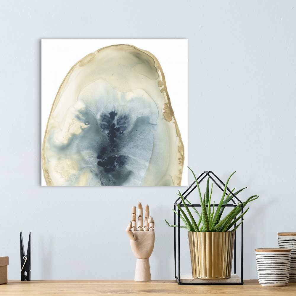 A bohemian room featuring Watercolor painting of a geode stone with blue accents on a white background.