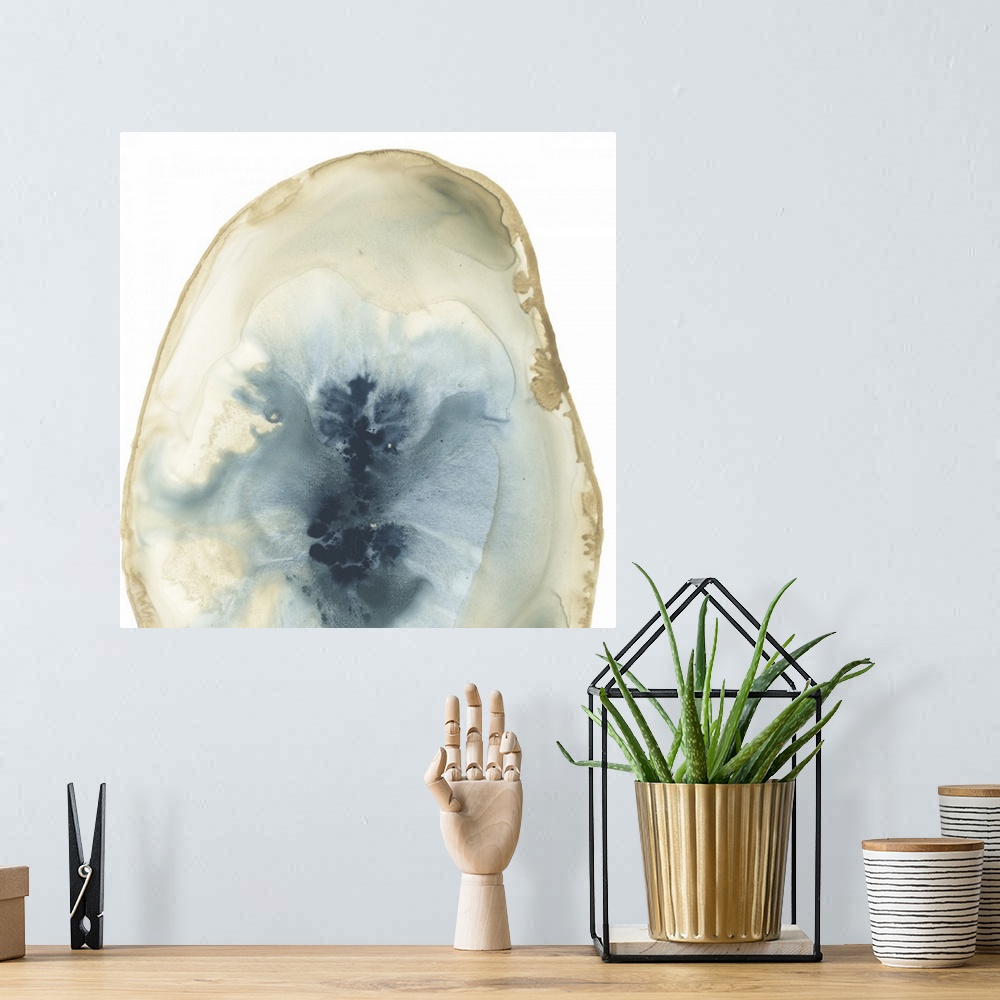 A bohemian room featuring Watercolor painting of a geode stone with blue accents on a white background.
