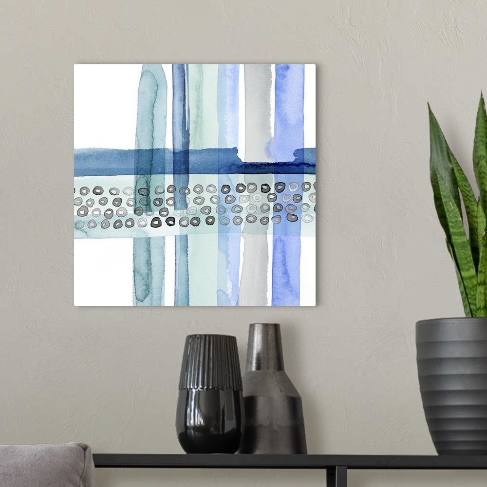 A modern room featuring Abstract watercolor painting made with cool tones and movement on a square background.