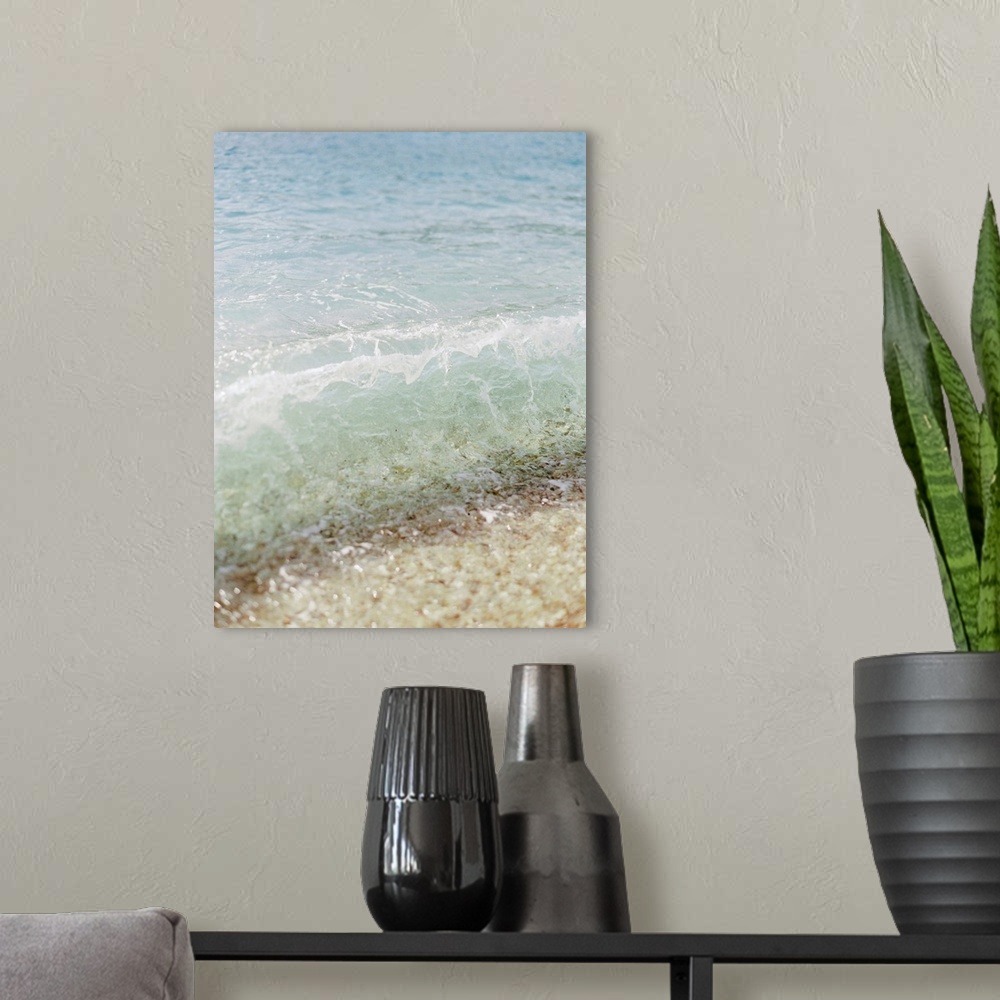 A modern room featuring Photograph of clear ocean water lapping the sand, Corfu, Greece.