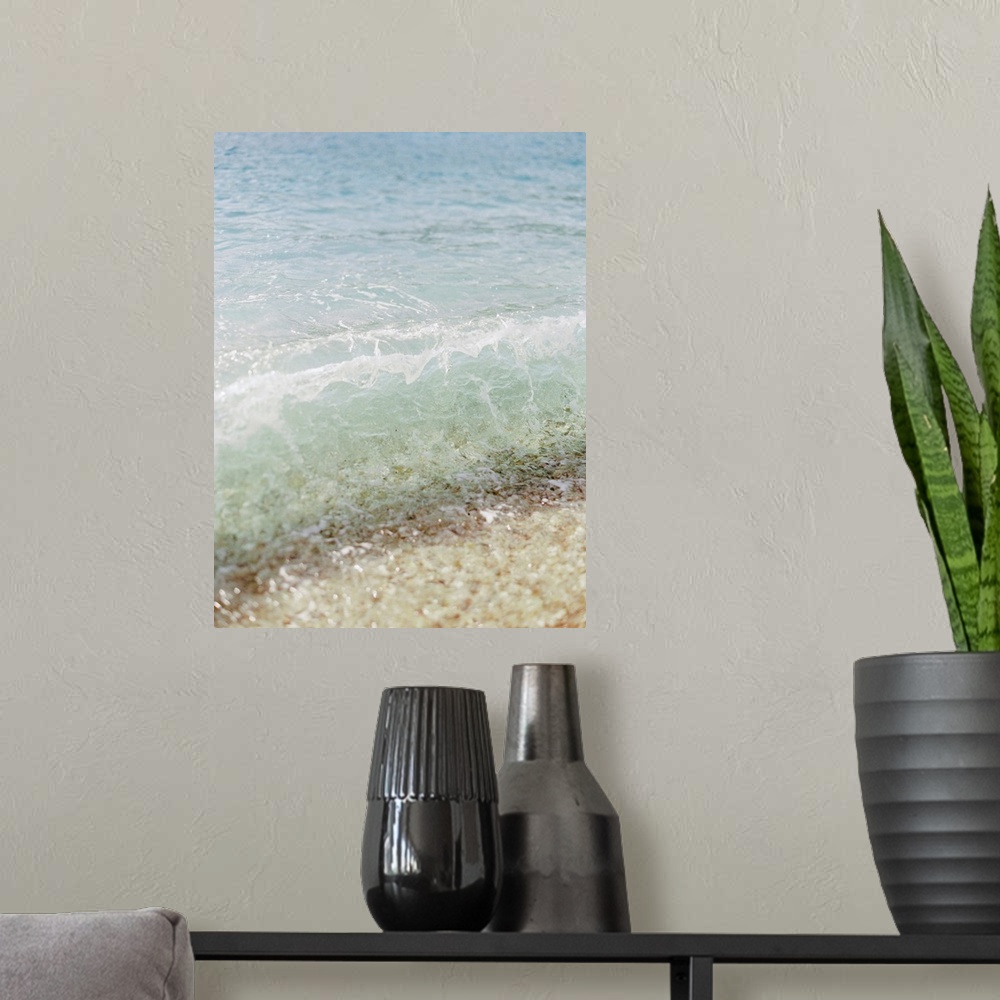 A modern room featuring Photograph of clear ocean water lapping the sand, Corfu, Greece.