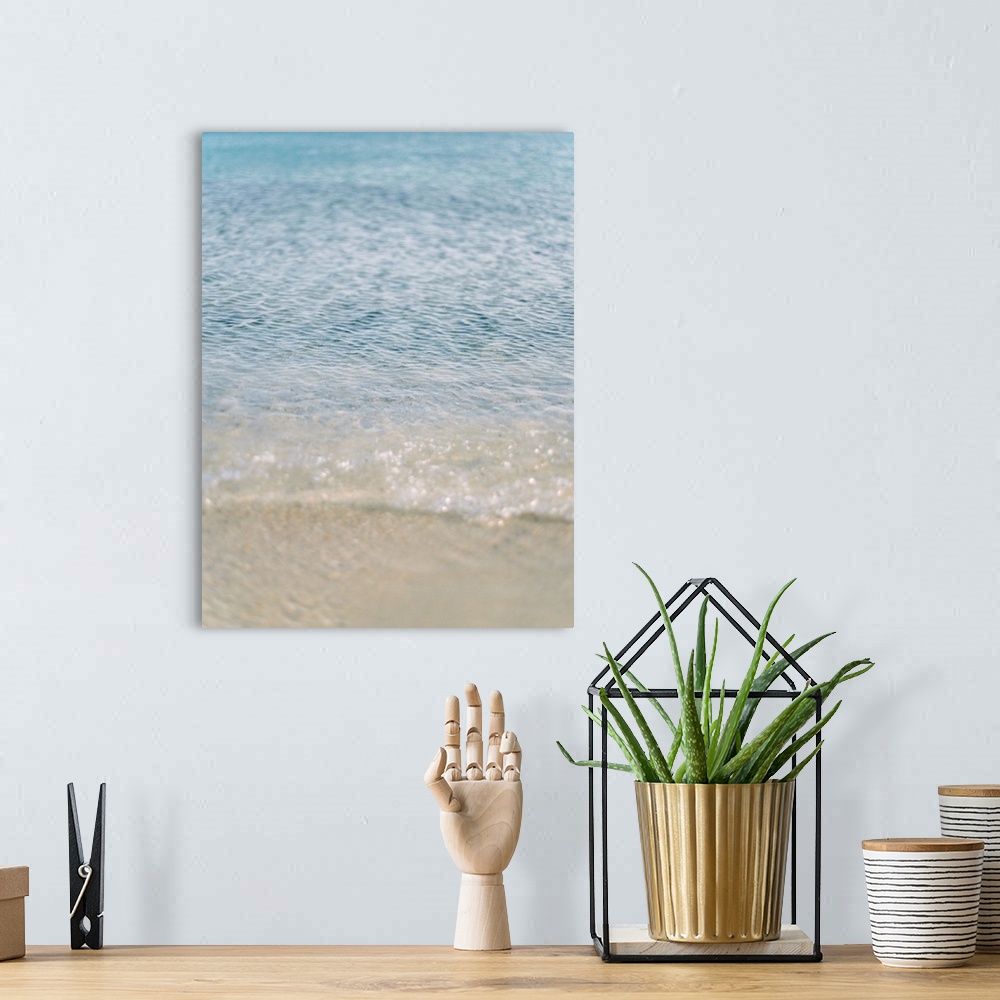 A bohemian room featuring Photograph of clear ocean water lapping the sand, Corfu, Greece.