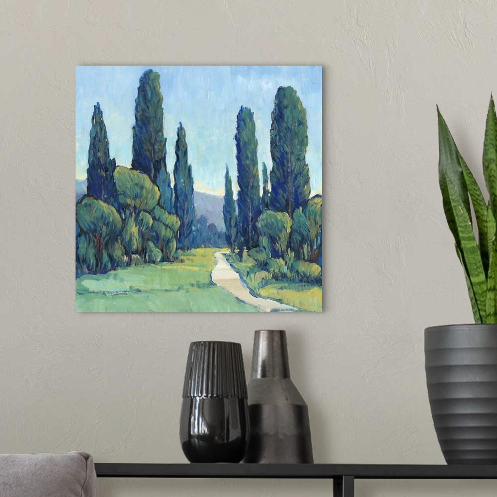 A modern room featuring Square painting of a green landscape filled with trees and a path leading to the background.