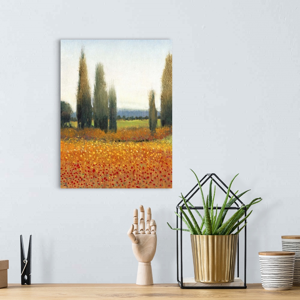 A bohemian room featuring Painting of a row of cypress trees in the Italian countryside.