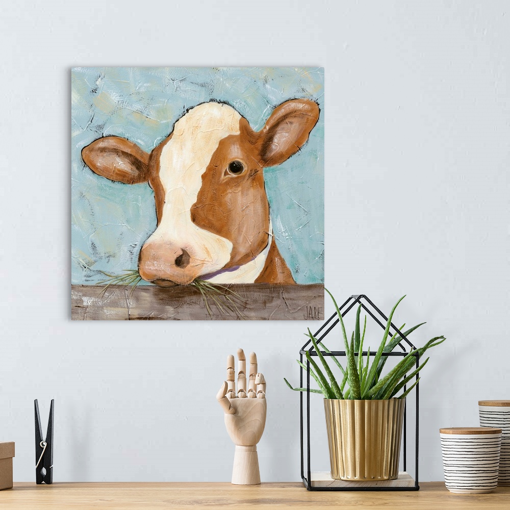 A bohemian room featuring Contemporary painting of a portrait of a cow.