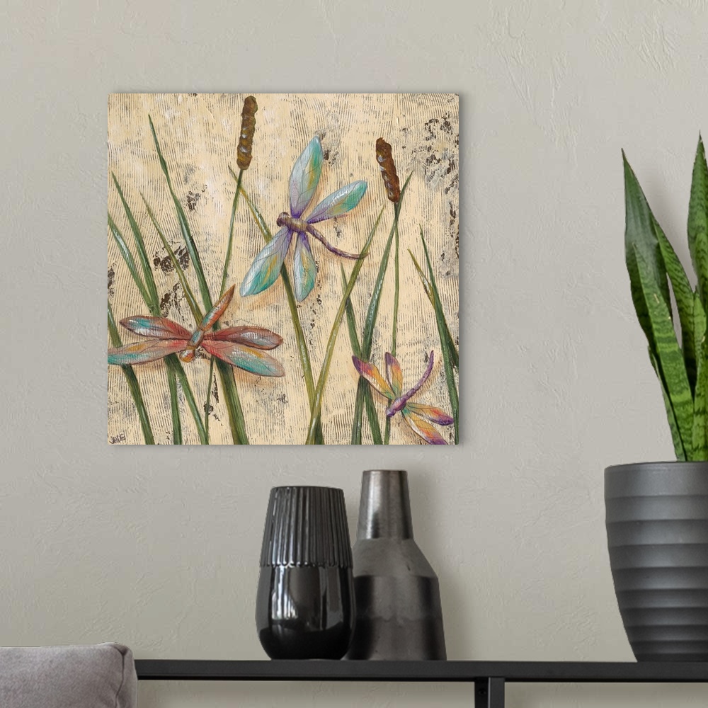 A modern room featuring A transitional image of three jewel-toned dragonflies hovering among cattail grasses. This artwor...