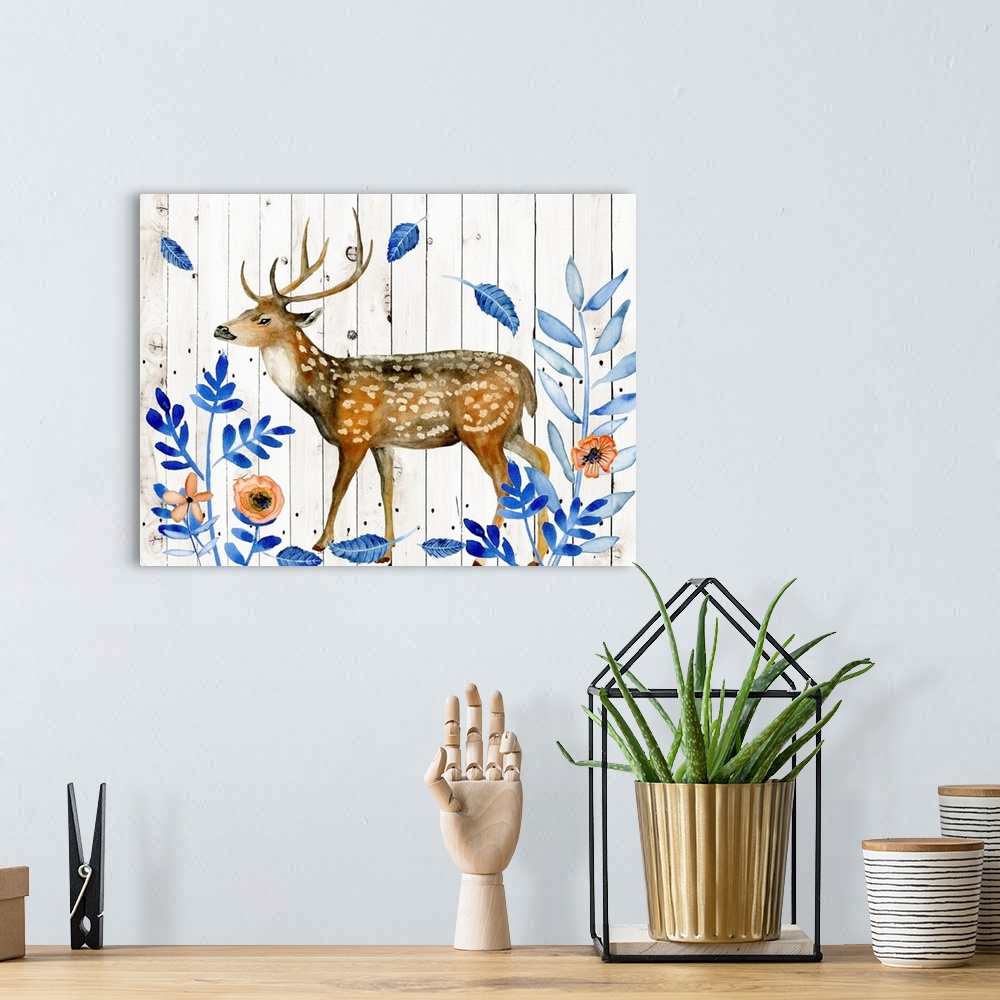 A bohemian room featuring Contemporary artwork of a poised watercolor deer trekking while blue leaves fall and is surrounde...