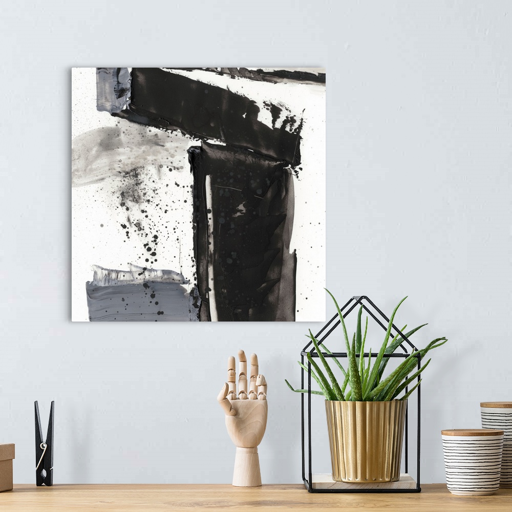 A bohemian room featuring Abstract painting of chaotic wide black and gray brush stroke with overlaying splatters of black.