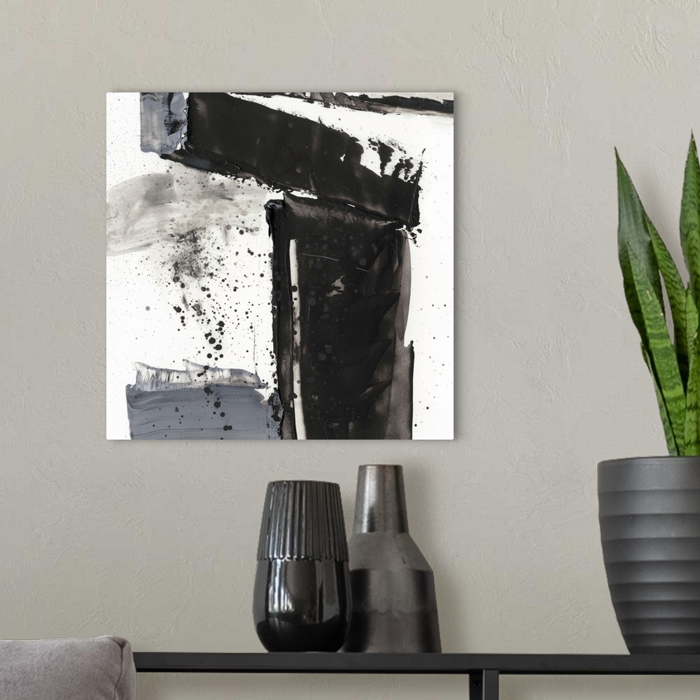 A modern room featuring Abstract painting of chaotic wide black and gray brush stroke with overlaying splatters of black.