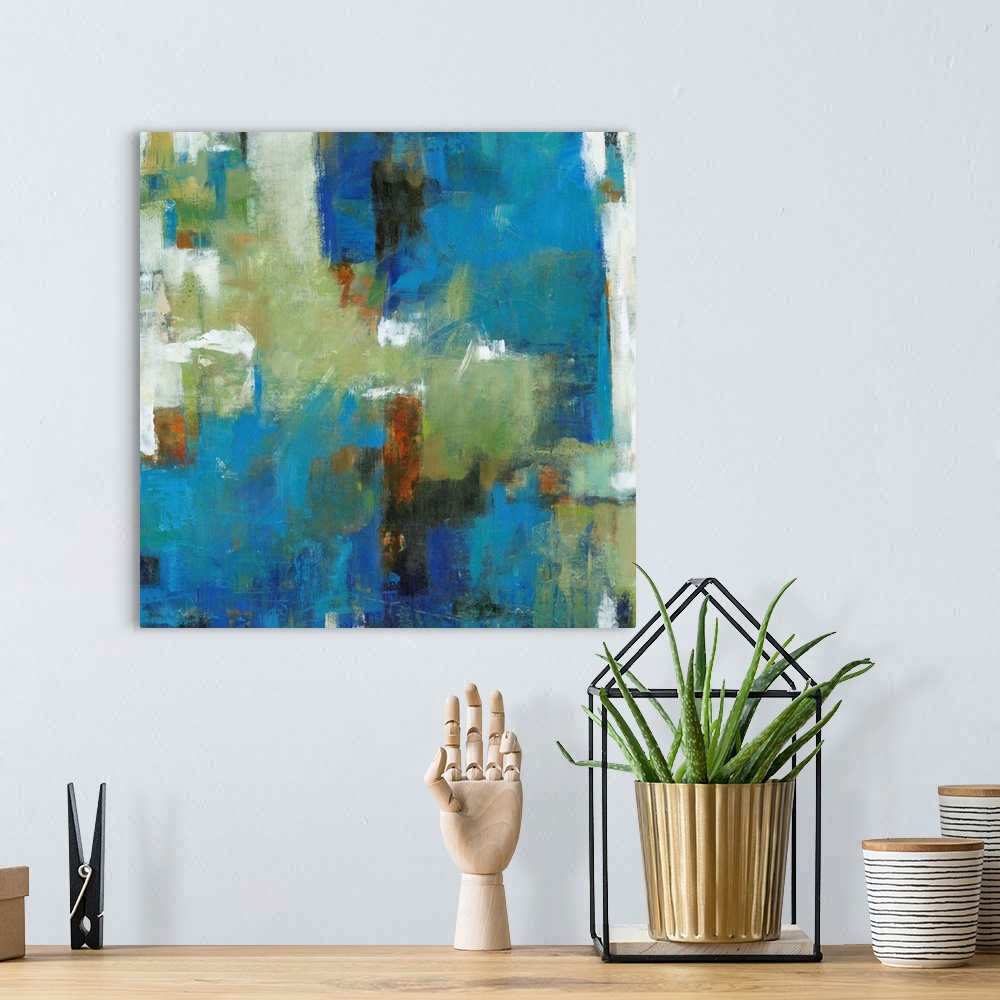 A bohemian room featuring Contemporary abstract painting using vibrant blue and green tones.