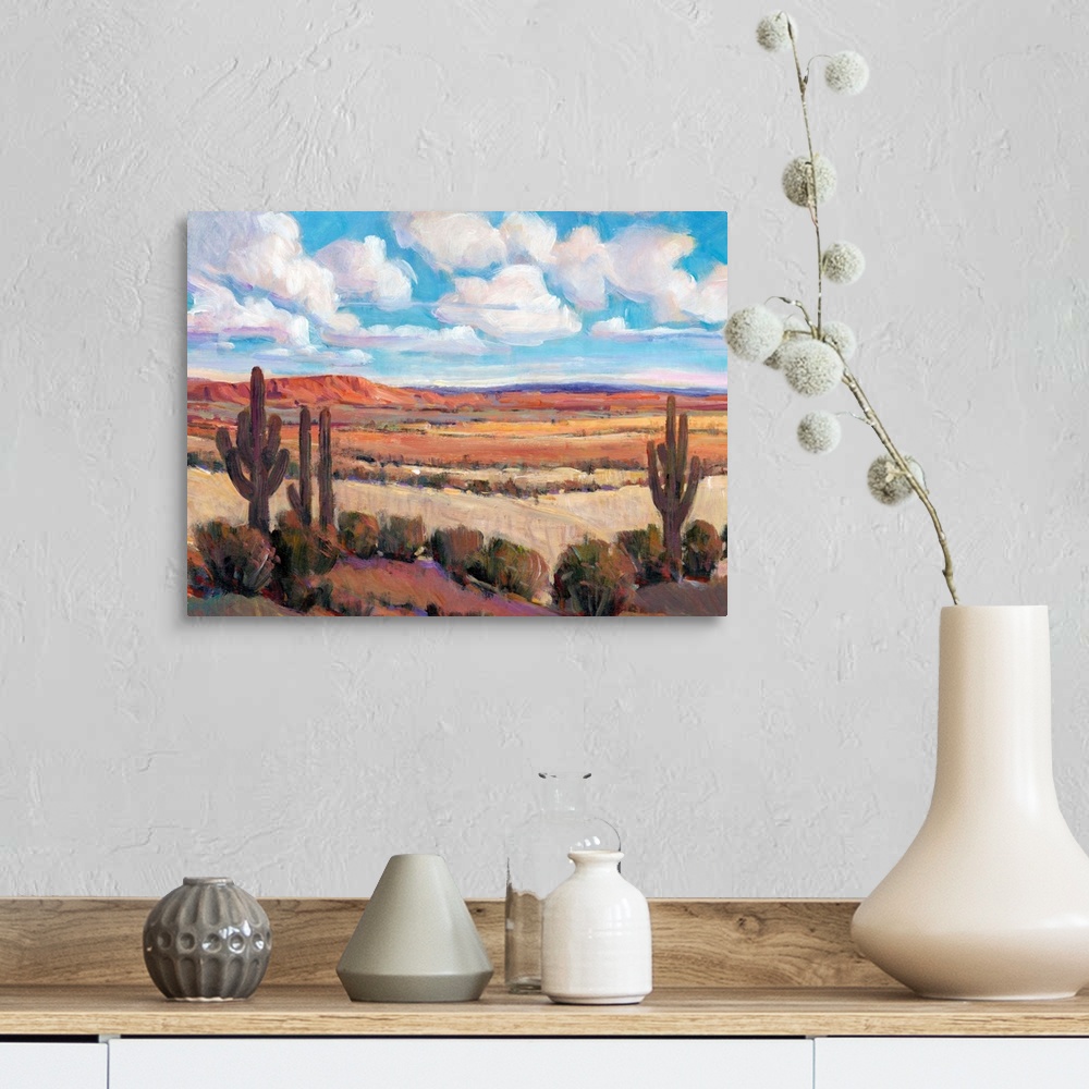 A farmhouse room featuring Contemporary landscape painting of a bright blue cloudy sky overlooking a desert.