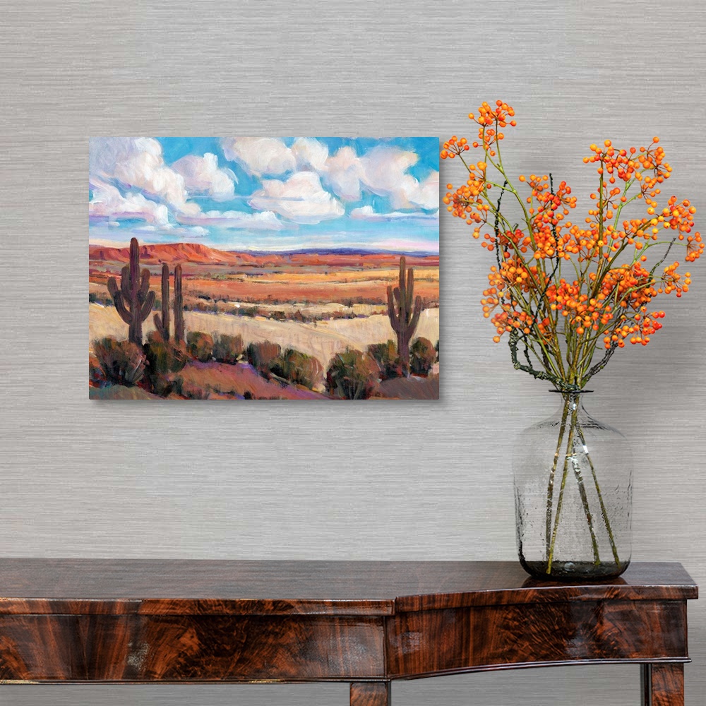 A traditional room featuring Contemporary landscape painting of a bright blue cloudy sky overlooking a desert.