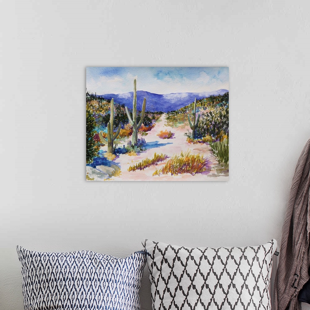 A bohemian room featuring A beautiful watercolor painting of tall cactus in a lush desert landscape
