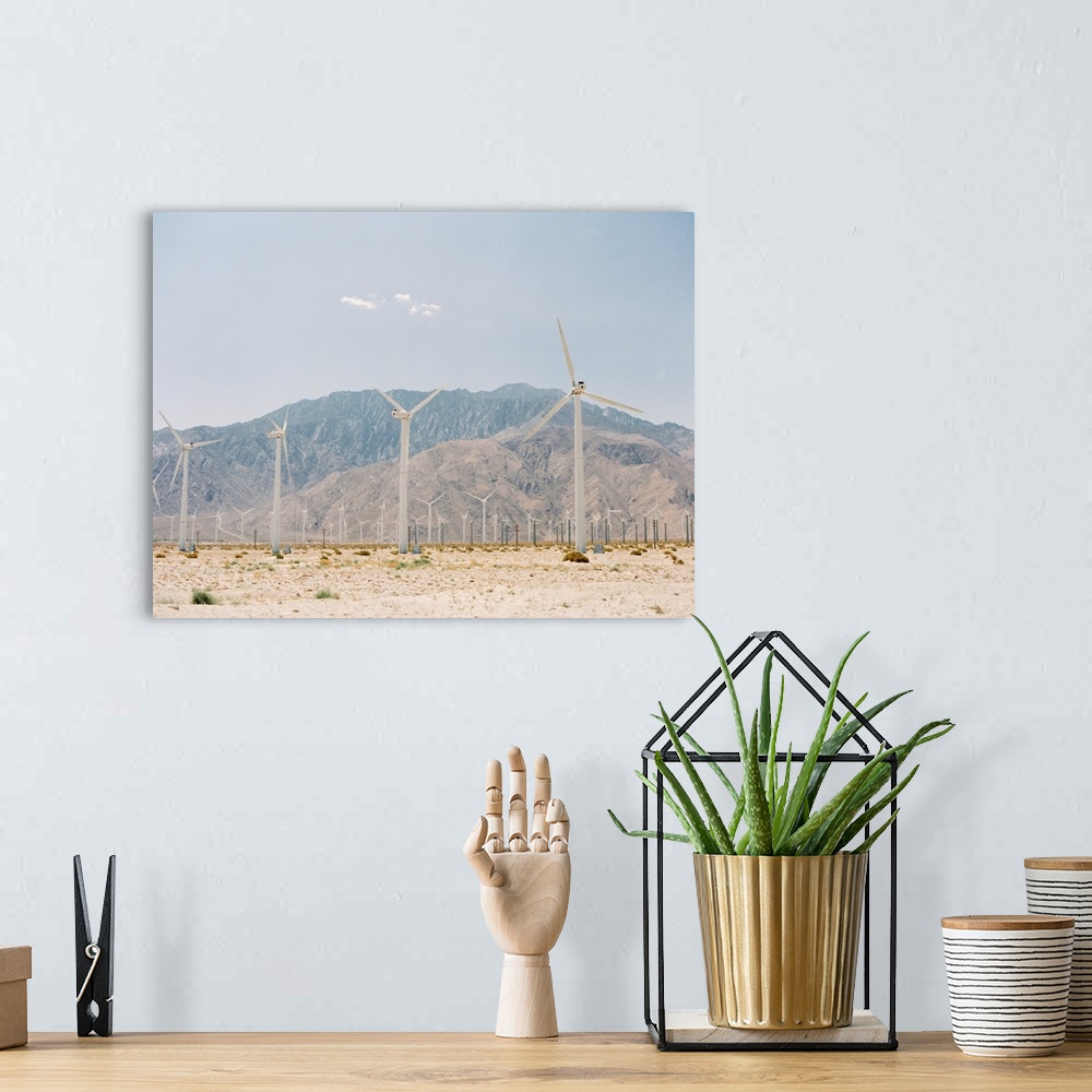 A bohemian room featuring Photograph of a wind power farm outside of Palm Springs, California.