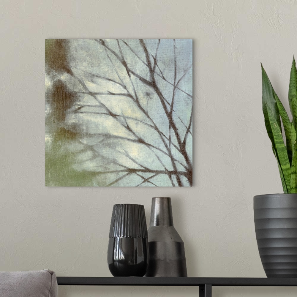 A modern room featuring Square painting on canvas of tree branches.