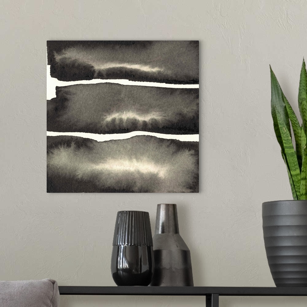 A modern room featuring Abstract artwork of three blocks of charcoal grey paint with watery centers.