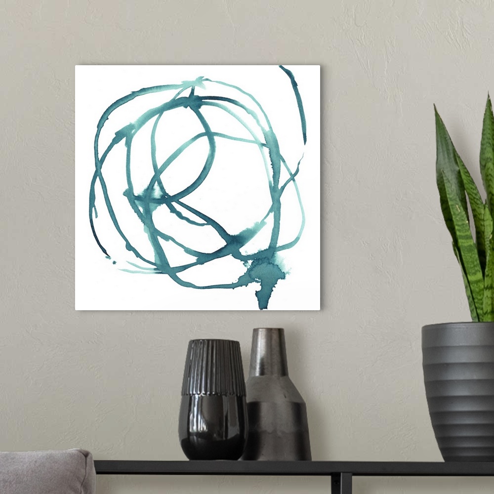 A modern room featuring Contemporary painting of overlapping circles of blue in medium brush strokes on a white background.