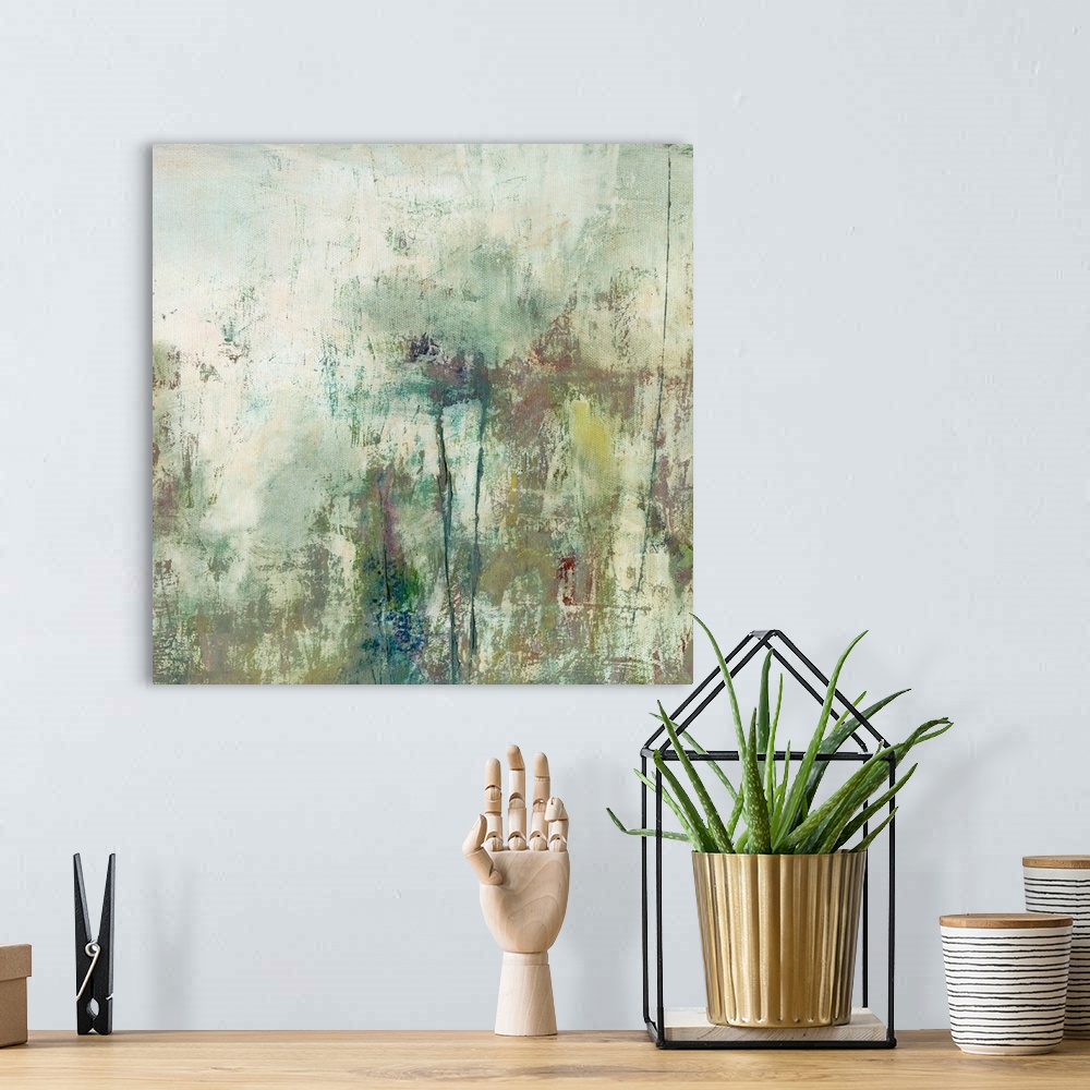 A bohemian room featuring Abstract artwork in mossy green shades and textures.