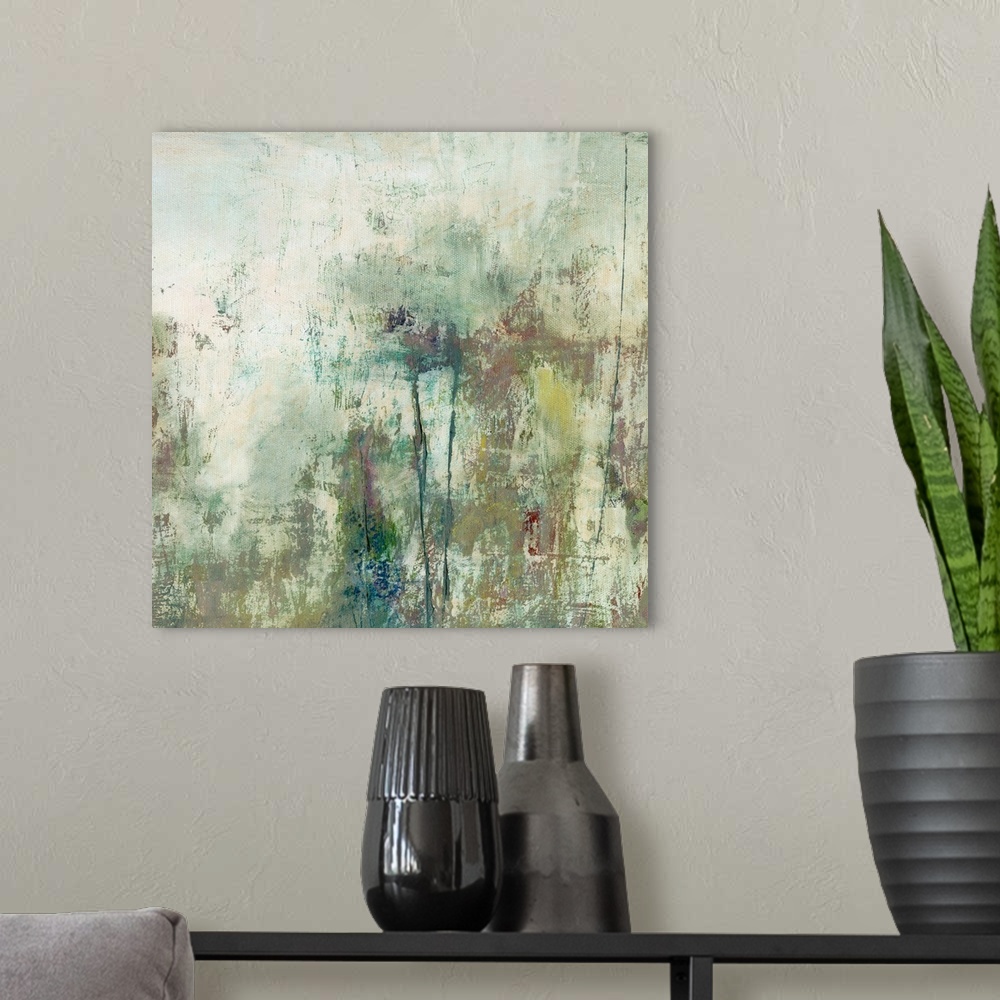 A modern room featuring Abstract artwork in mossy green shades and textures.