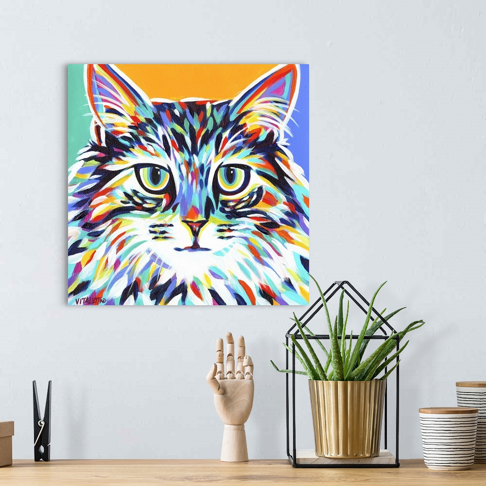 A bohemian room featuring A dramatic painting of a cat in multiple colored brush strokes against of teal, orange and blue b...