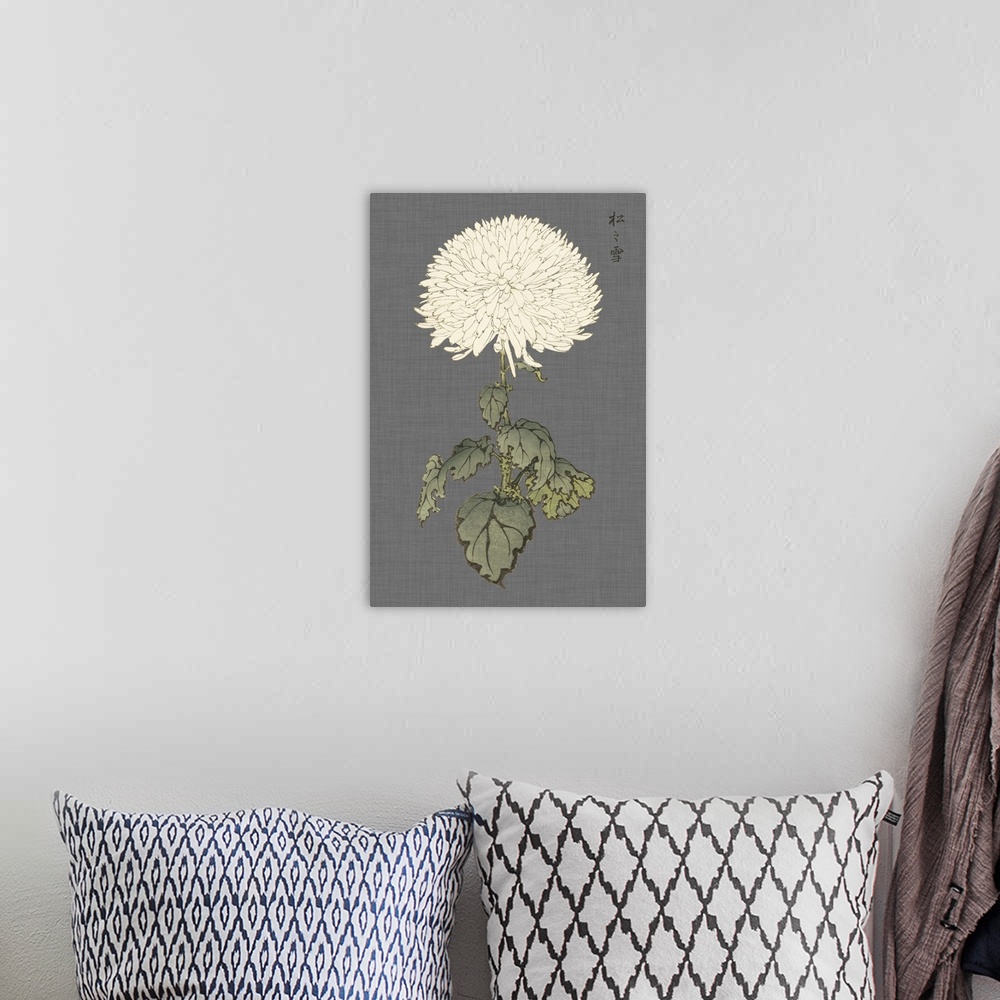 A bohemian room featuring Decorative art with a large ivory mum on a gray textured background.