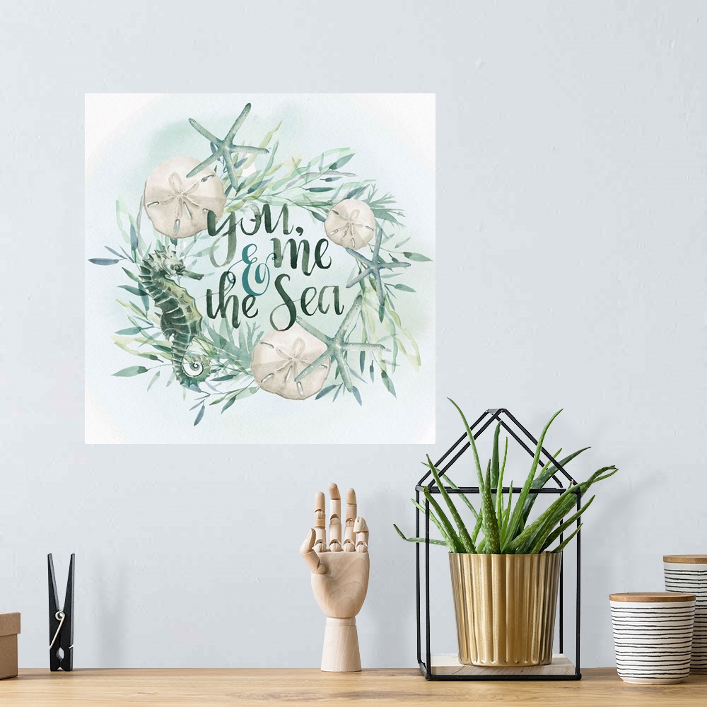 A bohemian room featuring Beach-themed wreath with text "You, me, and the sea" in watercolor.