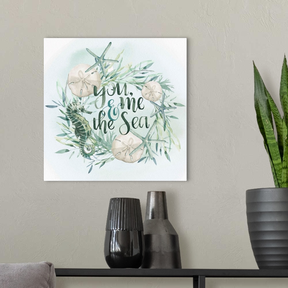 A modern room featuring Beach-themed wreath with text "You, me, and the sea" in watercolor.