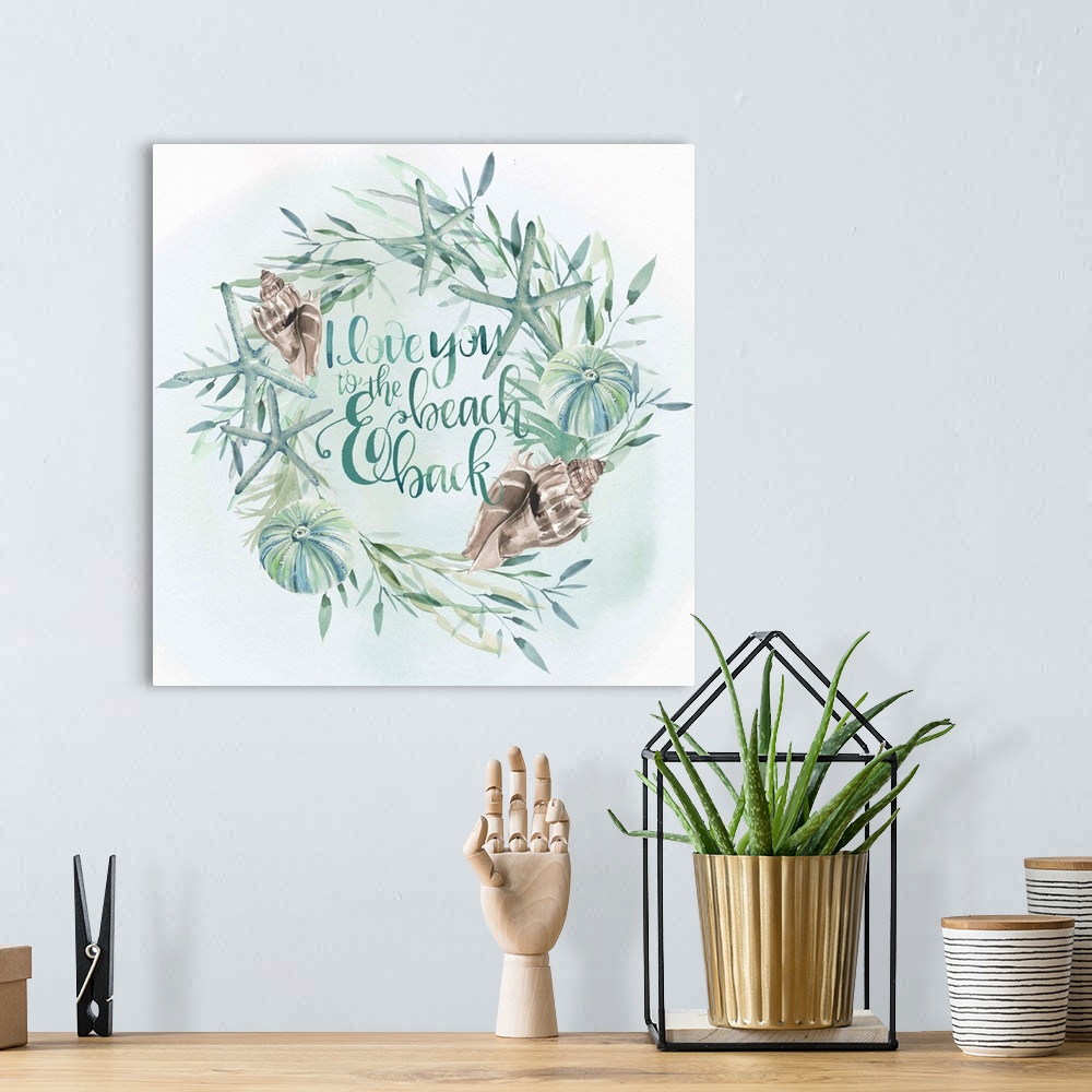 A bohemian room featuring Beach-themed wreath with text "I love you to the beach and back" in watercolor.