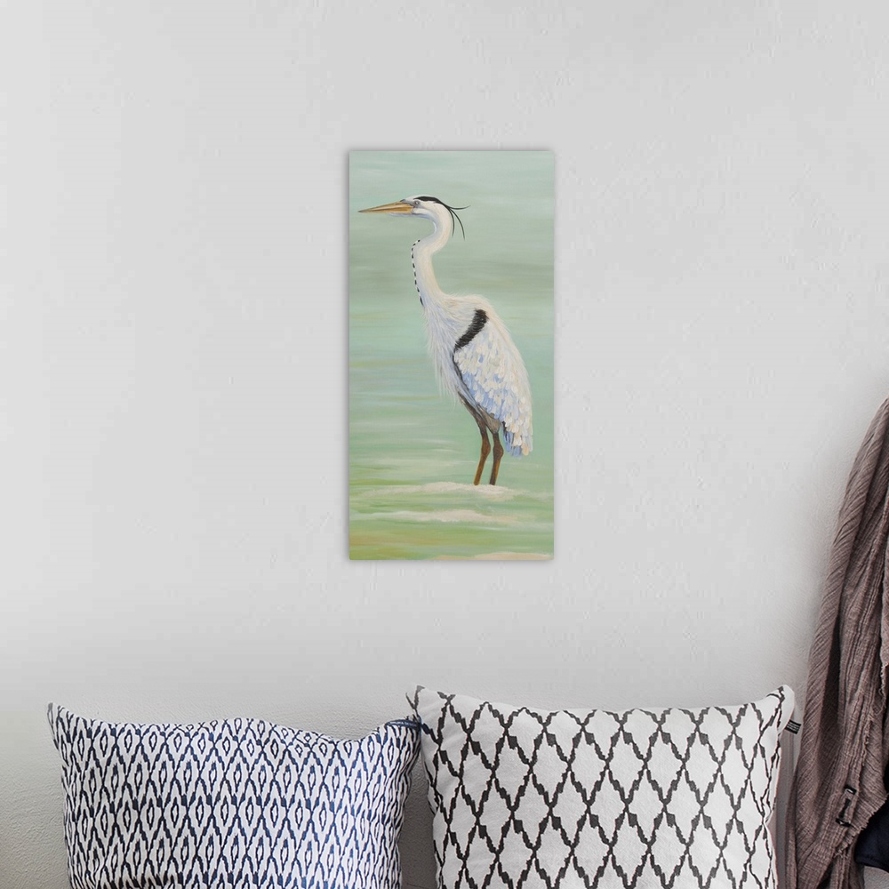 A bohemian room featuring Painting of a tall heron standing in shallow water.