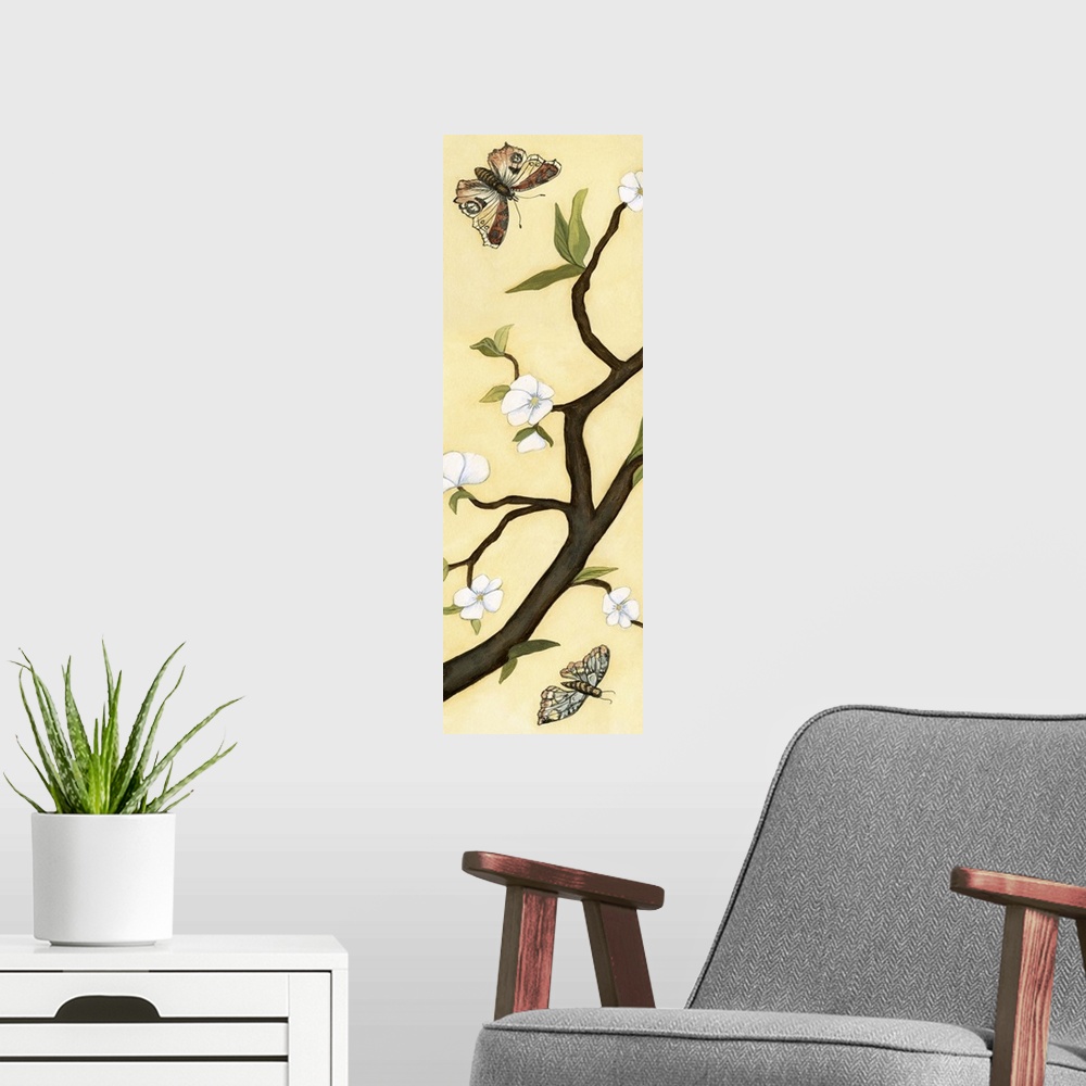 A modern room featuring Contemporary decor artwork of white flowers on a dark brown tree branch against a pale yellow bac...