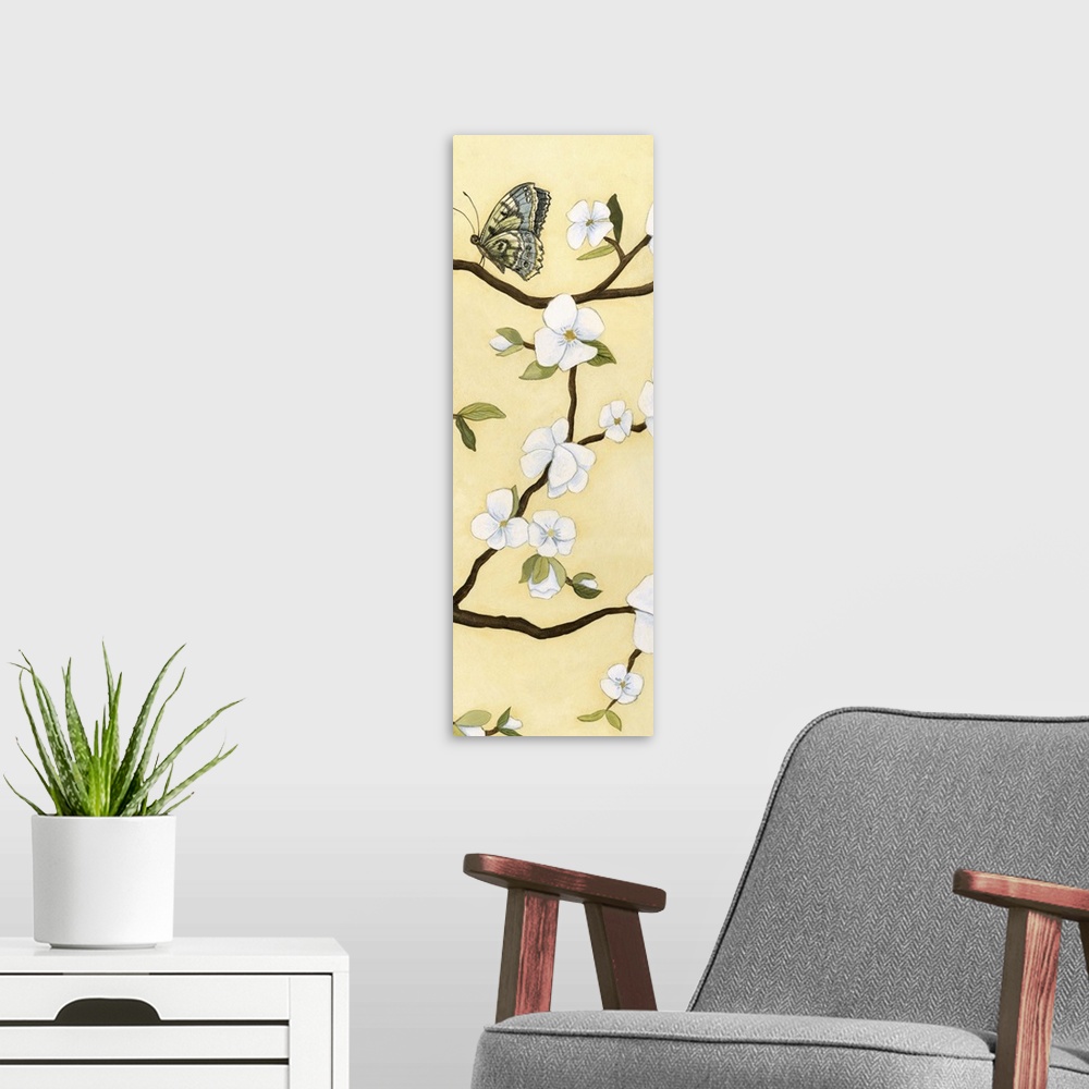 A modern room featuring Contemporary decor artwork of white flowers on a dark brown tree branch against a pale yellow bac...