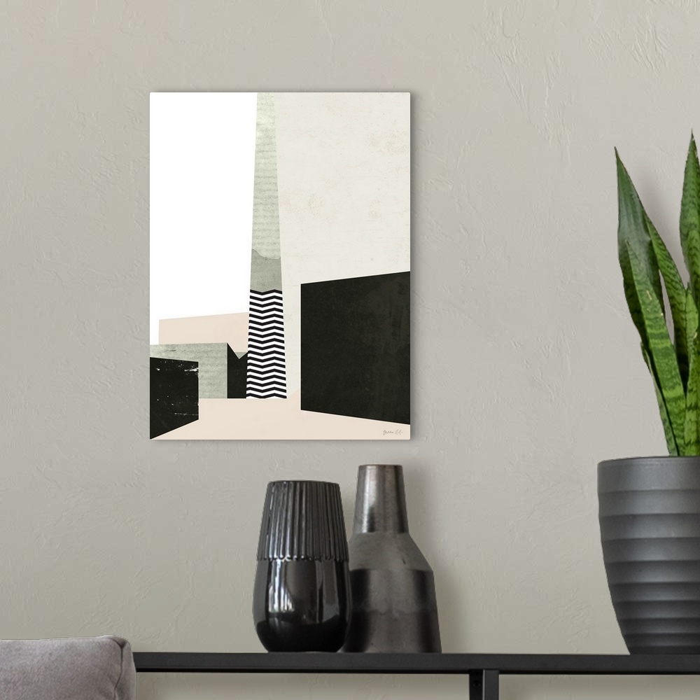 A modern room featuring Geometric abstract painting of shapes in black, beige, and pale pink.