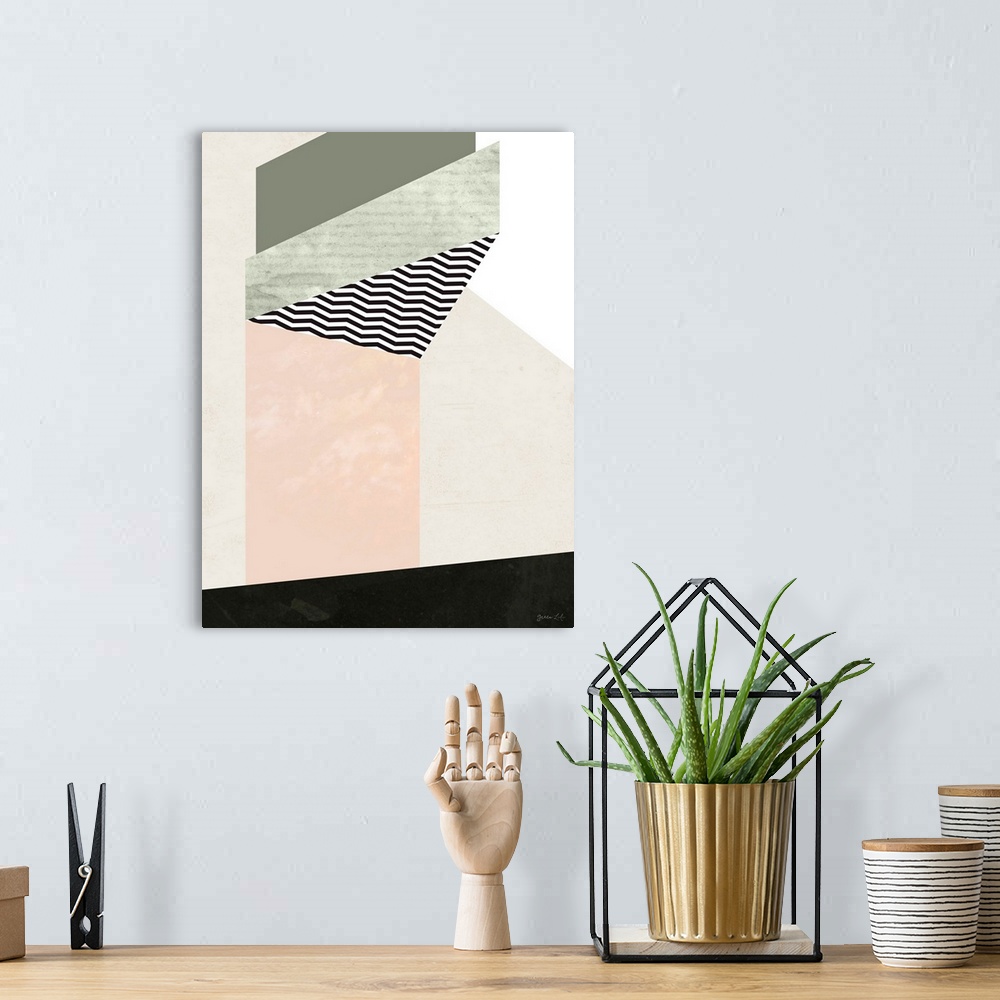 A bohemian room featuring Geometric abstract painting of shapes in black, beige, and pale pink.