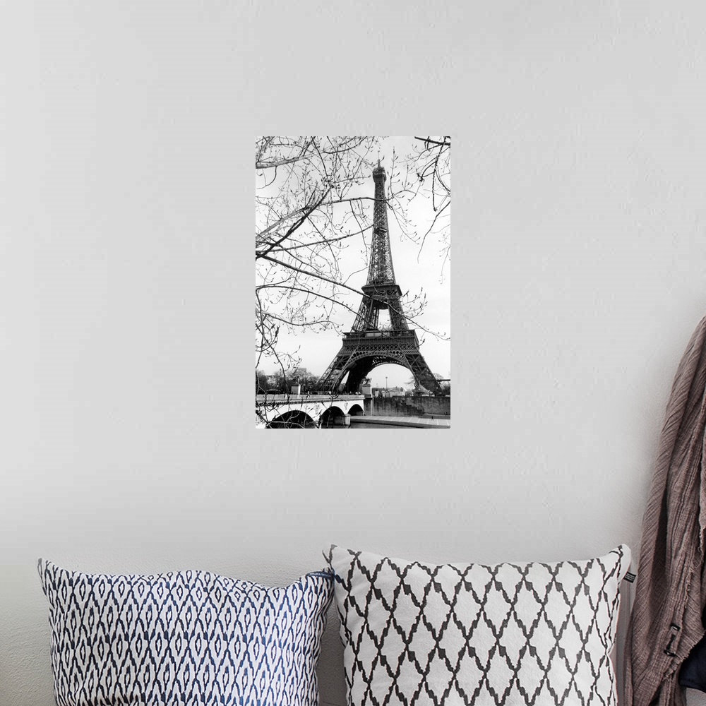 A bohemian room featuring View of the Eiffel Tower through the budding tree branches at the base of the Seine River.