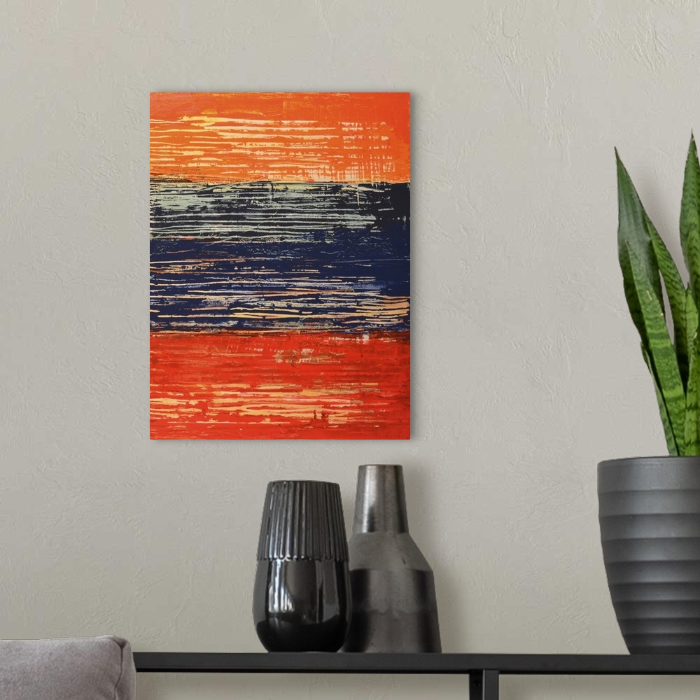 A modern room featuring Abstract art using orange, red and dark blue in a weathered and worn look.