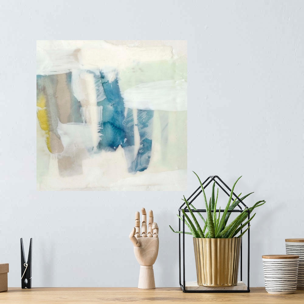 A bohemian room featuring Pale colored abstract artwork in shades of yellow and mint green.