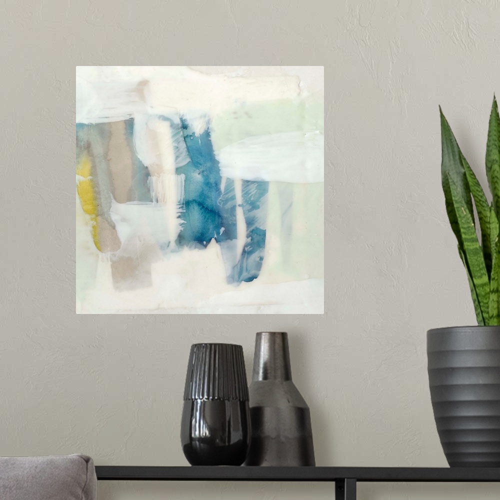 A modern room featuring Pale colored abstract artwork in shades of yellow and mint green.