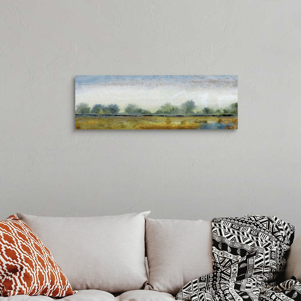 A bohemian room featuring Contemporary landscape painting of an open field with trees along the edge.