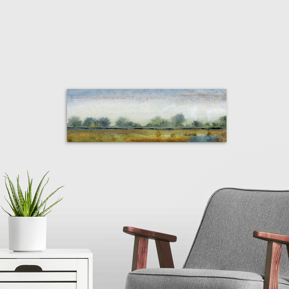 A modern room featuring Contemporary landscape painting of an open field with trees along the edge.