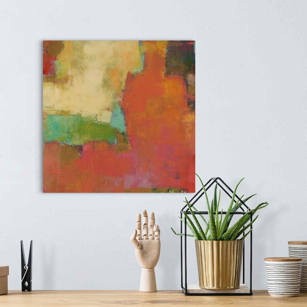 A bohemian room featuring Square abstract artwork made with vibrant colors.