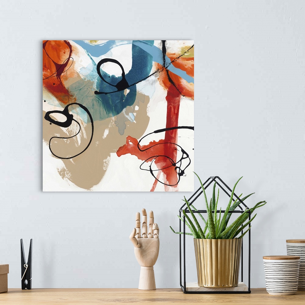 A bohemian room featuring Contemporary abstract artwork in wild swirls and splatters in black, red, blue, and tan.