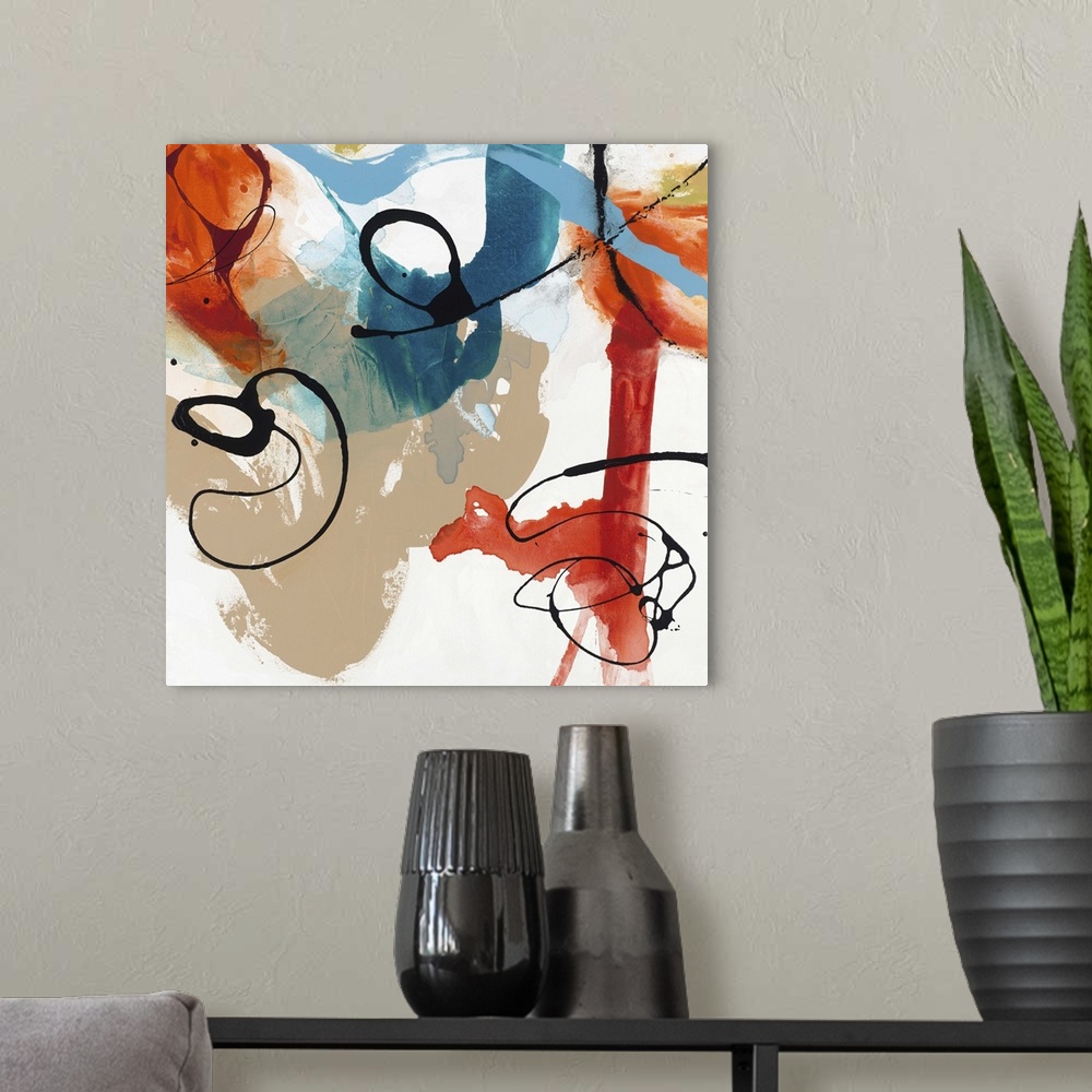 A modern room featuring Contemporary abstract artwork in wild swirls and splatters in black, red, blue, and tan.