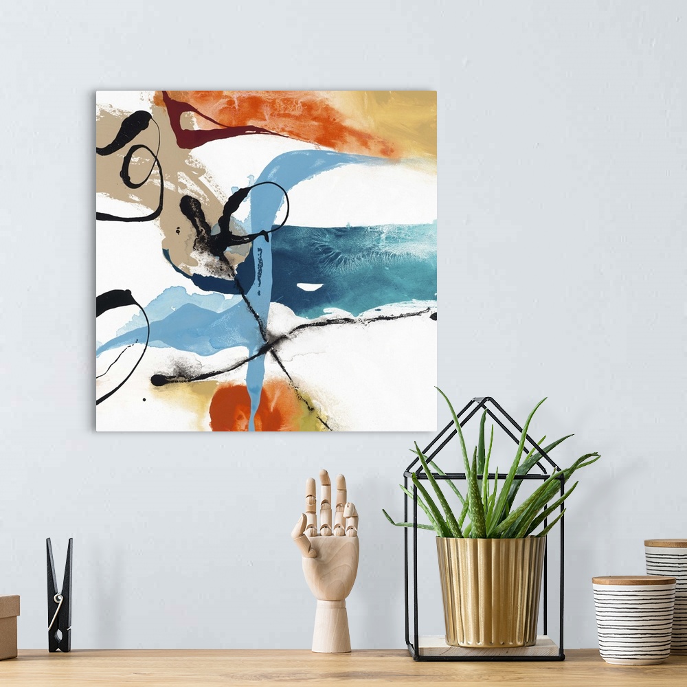 A bohemian room featuring Contemporary abstract artwork in wild swirls and splatters in black, orange, blue, and tan.