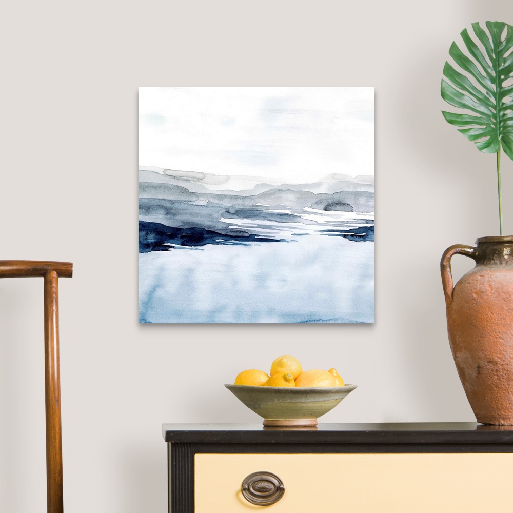A traditional room featuring Watercolor landscape art of a pale blue ocean under a light grey sky.