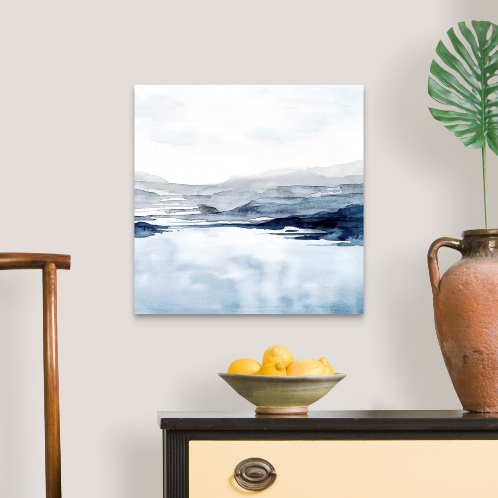 A traditional room featuring Watercolor landscape art of a pale blue ocean under a light grey sky.