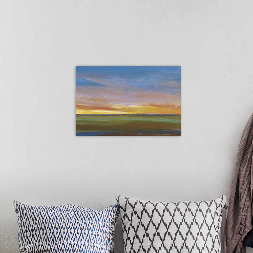 A bohemian room featuring Contemporary painting of a landscape at sunset, with colorful clouds.
