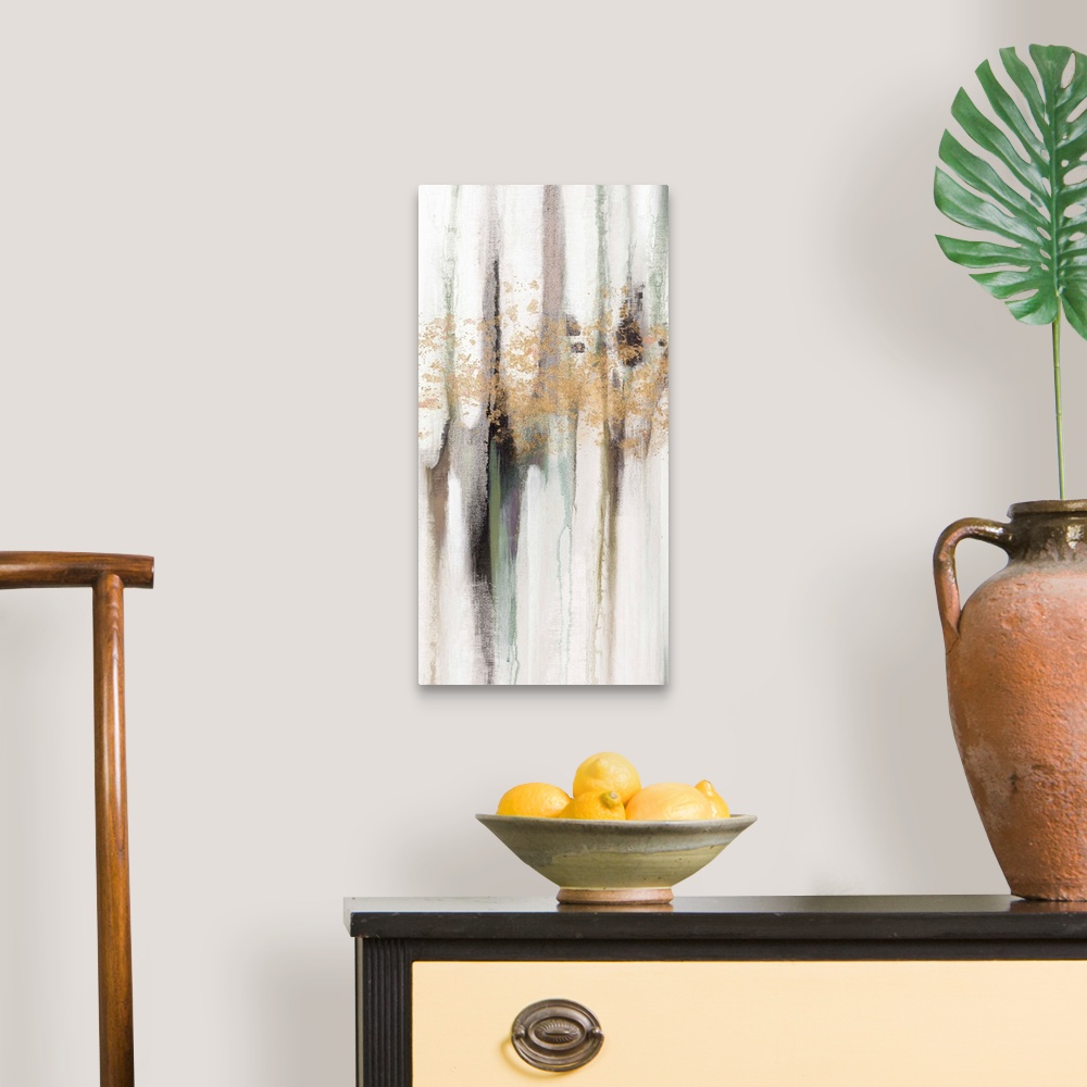 A traditional room featuring Contemporary abstract painting using tones of pale gray and gold splashes of color.