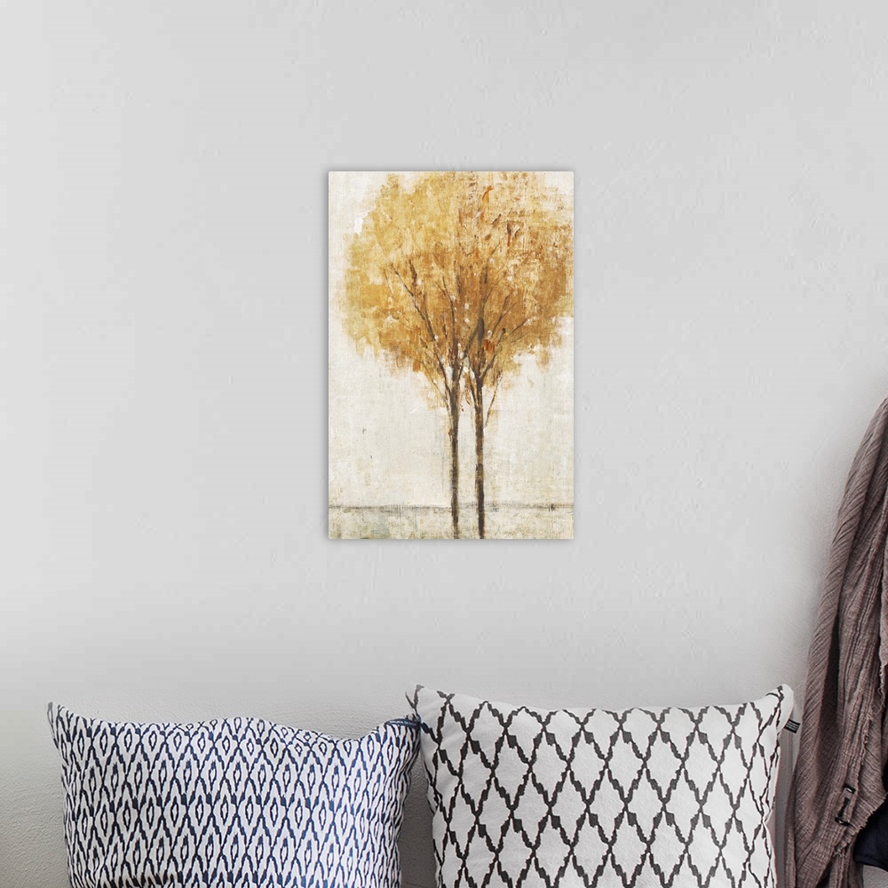 A bohemian room featuring Contemporary artwork of two trees in a field in autumn.