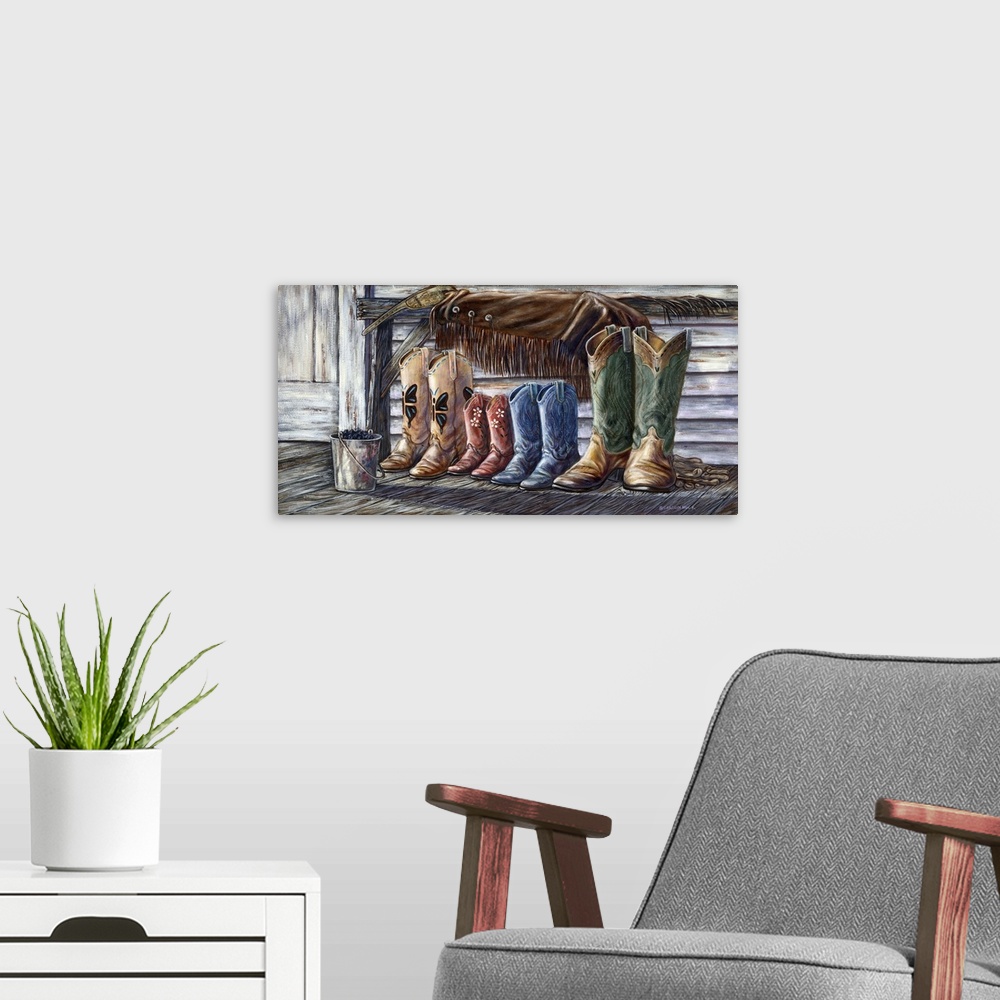 A modern room featuring Contemporary painting of a family of different sized cowboy boots.